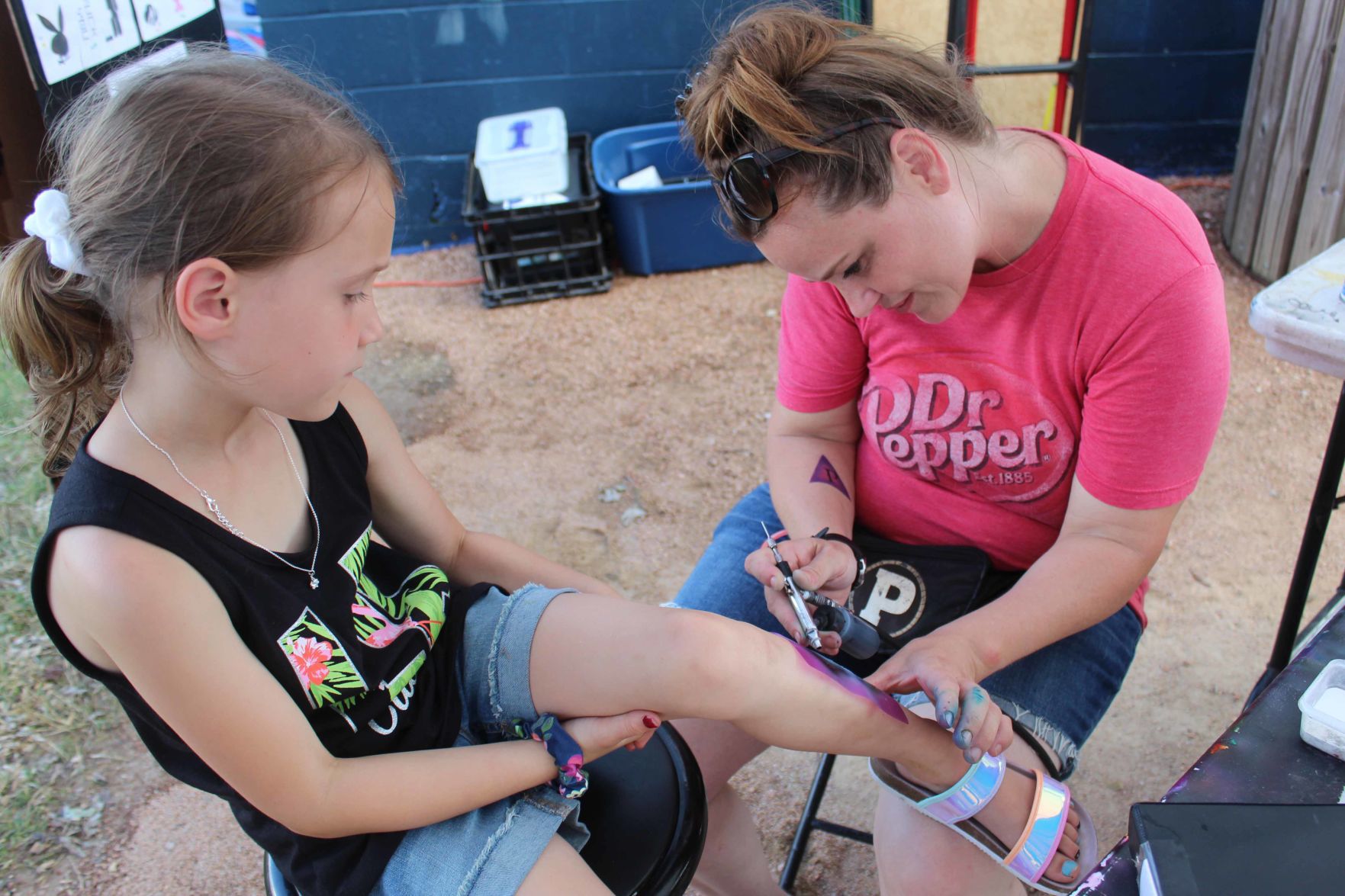 Aliyah gets airbrush tattoo (copy)